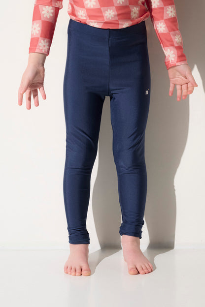 Legging de bain anti-UV bleu marine pour enfant, extensible, certifié UPF50+, idéal pour la protection solaire.