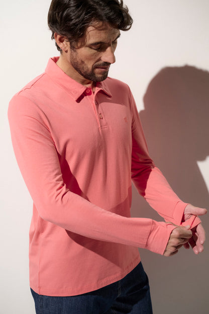 Polo anti-UV rose à manches longues pour homme, certifié UPF 50+, idéal pour la protection solaire quotidienne.